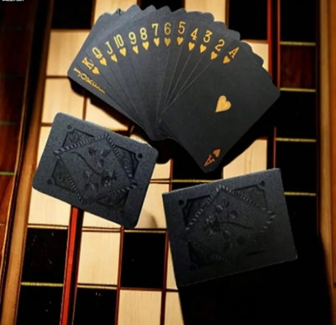 Black and gold play cards